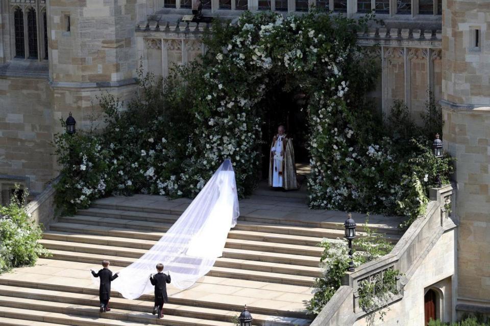 The page boys hold Meghan's veil before she enters St George's Chapel (Getty Images)