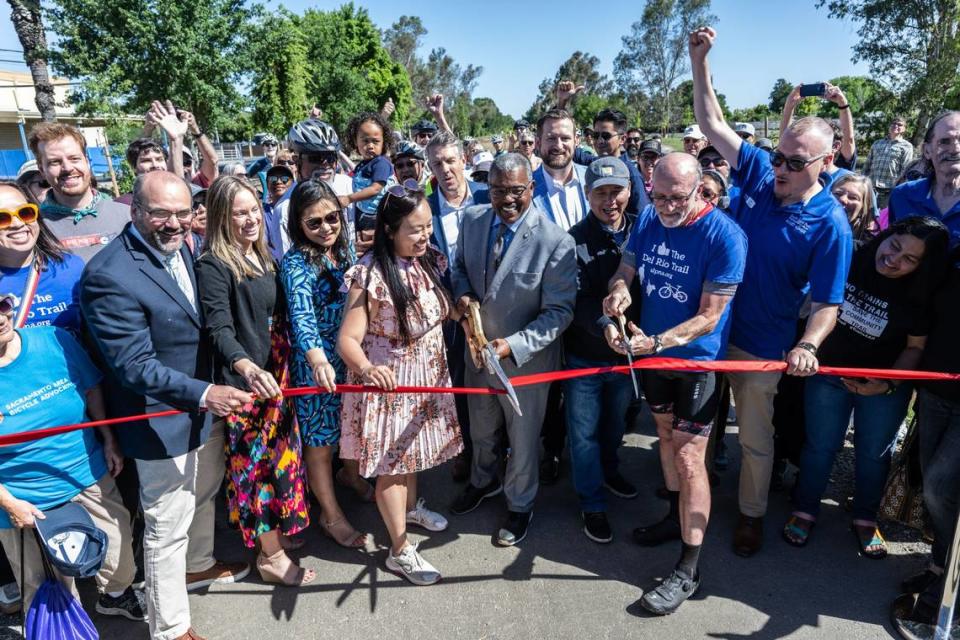 Sacramento City Councilman Rick Jennings, center, and former councilman Jay Schenirer cut a ribbon to formally open the Del Rio Trail on Thursday on Freeport Boulevard near Florin Road.