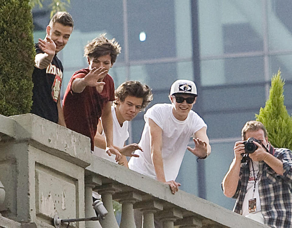 Speaking of famous pop stars, a gaggle of fans got the greeting of their lives when the fellas of British band One Direction waved to the crowd from their hotel in Mexico City on Monday. (6/10/2013)