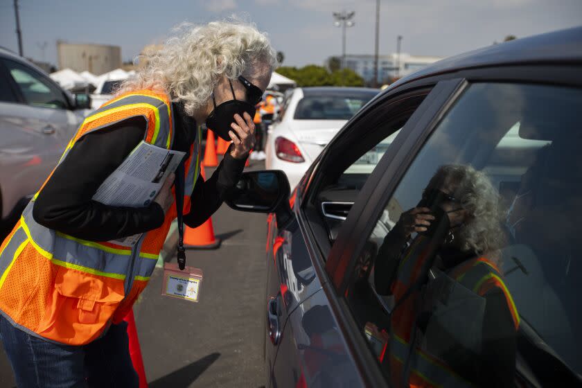 DOWNEY, CA - MARCH 13: Barbara Ferrer, L.A. County Public Health Director, is working at the LA County Covid-19 vaccine site located at the County Office of Education on Saturday, March 13, 2021 in Downey, CA. Ferrer will be monitoring people after they get their vaccines while they sit in their cars to see whether they experience any adverse symptoms from the vaccine. (Francine Orr / Los Angeles Times)