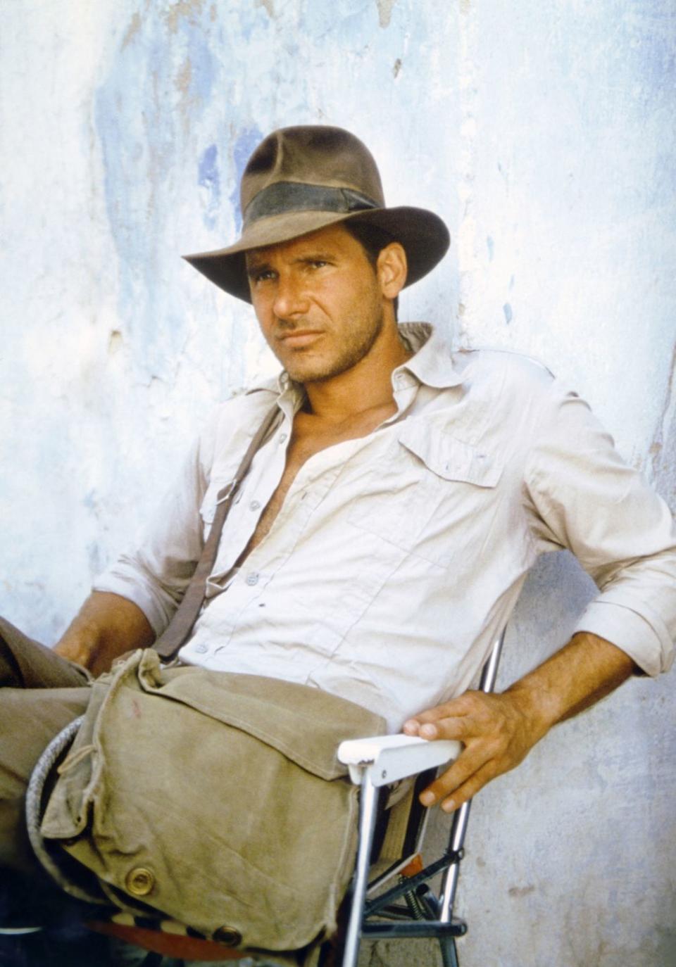 <p>Harrison Ford on the set of <em>Raiders of the Lost Ark</em>.</p>