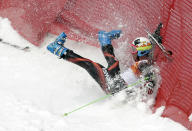 Spain's Alex Puente Tasias crashes in the first run of the men's giant slalom at the Sochi 2014 Winter Olympics, Wednesday, Feb. 19, 2014, in Krasnaya Polyana, Russia. (AP Photo/Charles Krupa)