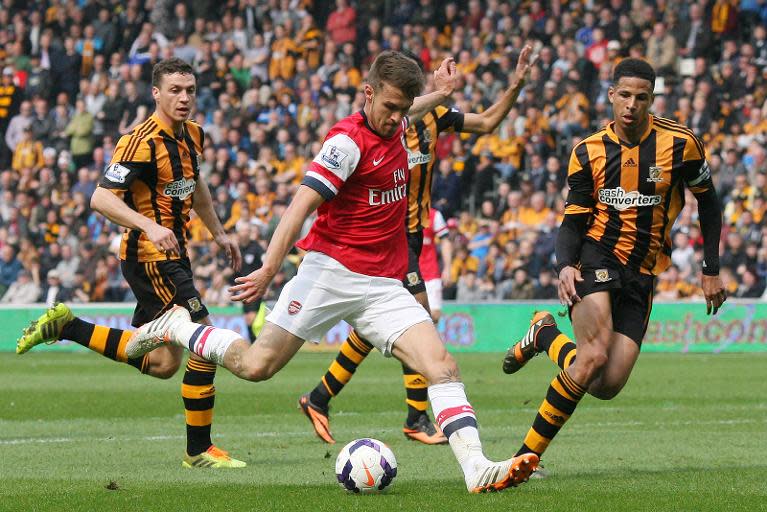 Arsenal's Aaron Ramsey scores their opening goal against Hull, at the KC Stadium in Hull, on April 20, 2014