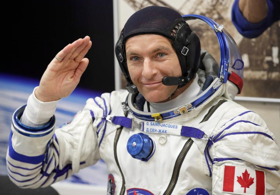 Canadian Space Agency David Saint-Jacques, a member of the mission's main crew to the International Space Station, gestures before the launch of the Soyuz MS-11 spacecraft in Kazakhstan on Monday, December 3, 2018.