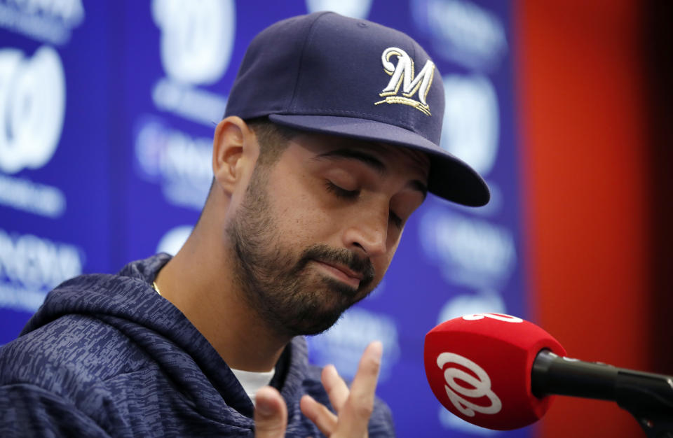Milwaukee Brewers pitcher Gio Gonzalez pauses while speaking during a media availability after he was recently acquired in a trade with the Washington Nationals at Nationals Park, Friday, Aug. 31, 2018, in Washington. (AP Photo/Alex Brandon)