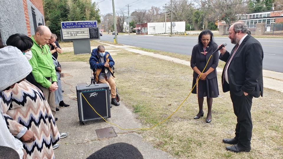 The Rev. Rob James of First Baptist Church prays in front of Greater Unity Tabernacle Christian Church on Gillespie Street on Dec. 3, 2023. The downtown church has held a prayer service every Sunday at 2 p.m. since it was vandalized in November with hateful graffiti.