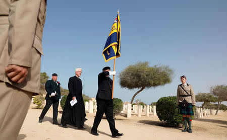 British soldiers with a priest march during a ceremony for the anniversary of the Battle of El Alamein, at El Alamein war cemetery in Egypt, October 20, 2018. REUTERS/Amr Abdallah Dalsh