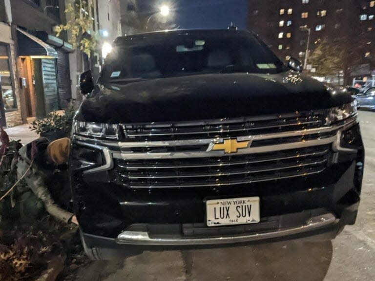 A New York City TX activist disarming an SUV with the numberplate ‘LUX SUV’