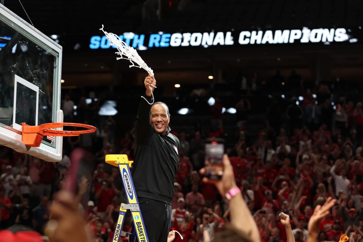 North Carolina State coach Kevin Keatts cuts down the net after his team defeated Duke in the South Regional championship game of the 2024 men's tournament at American Airline Center.