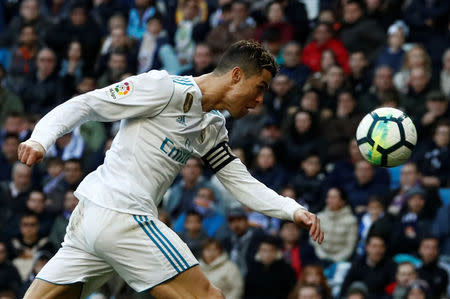 Soccer Football - La Liga Santander - Real Madrid vs Deportivo Alaves - Santiago Bernabeu, Madrid, Spain - February 24, 2018 Real Madrid’s Cristiano Ronaldo heads at goal REUTERS/Juan Medina