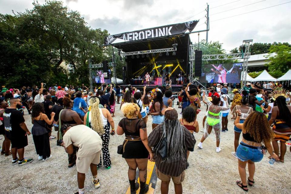 A crowd listens and dances to live music during AFROPUNK music festival at The Urban in the Historic Overtown neighborhood of Miami, Florida, on Saturday, May 21, 2022.