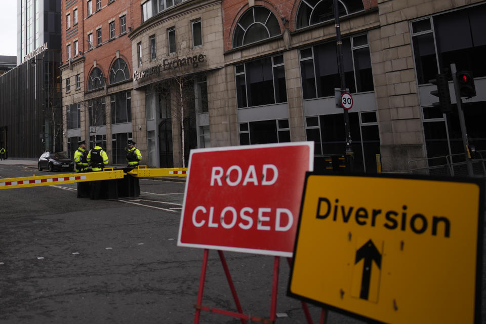 Police stand guard outside the hotel where President Joe Biden will stay in Belfast Northern Ireland, Tuesday, April 11, 2023. President Biden is visiting Northern Ireland and Ireland to celebrate the 25th Anniversary of the Good Friday Agreement. (AP Photo/Christophe Ena)