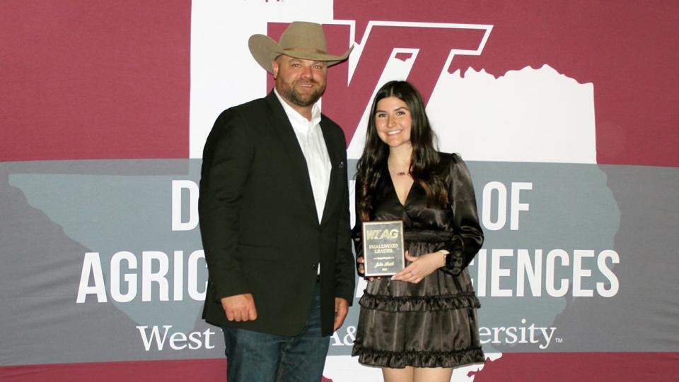 Ag Development Association board member Remington Holt presented the Smallwood Award to Julia Smith, one of several recent honorees at The Ag Gathering at West Texas A&M University.