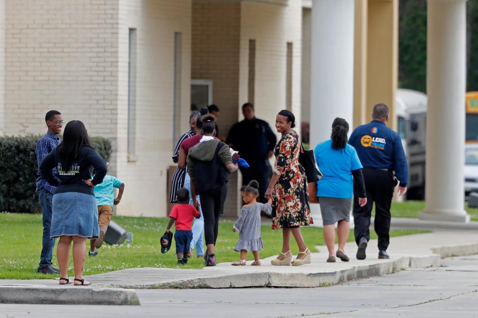 Congregants arrive at the Life Tabernacle Church in Central,  Sunday, March 29, 2020. Pastor Tony Spell has defied a shelter-in-place order by Louisiana Gov. John Bel Edwards, due to the new coronavirus pandemic, and continues to hold church services with hundreds of congregants.