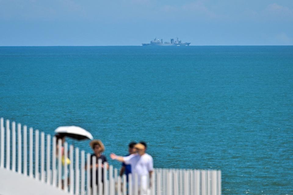 A Chinese military vessel sails off Pingtan island, one of mainland China’s closest point from Taiwan, in Fujian province on 5 August 2022 (AFP via Getty Images)