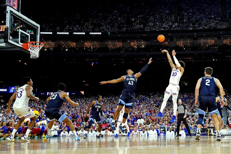 Kansas forward Jalen Wilson (10) shoots the ball over Villanova forward Eric Dixon April 2 in New Orleans. Wilson hopes to improve his long-distance shooting percentage this coming season.