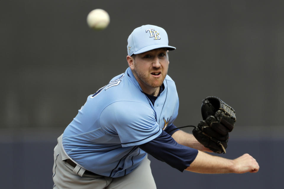 FILE - In this Feb. 27, 2020, file photo, New York Yankees' Tyler Zombro delivers a pitch during the sixth inning of a spring training baseball game against the New York Yankees in Tampa, Fla. Zombro was kept overnight at a hospital and remains in stable condition after being struck in the head by a line drive Thursday night, June 3, 2021, a frightening scene that prompted Triple-A Durham to suspend its game. (AP Photo/Frank Franklin II, File)