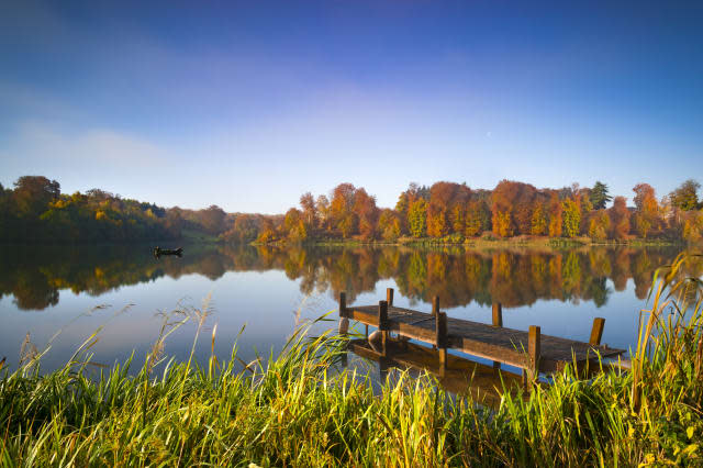 Still waters of a lake in autumn