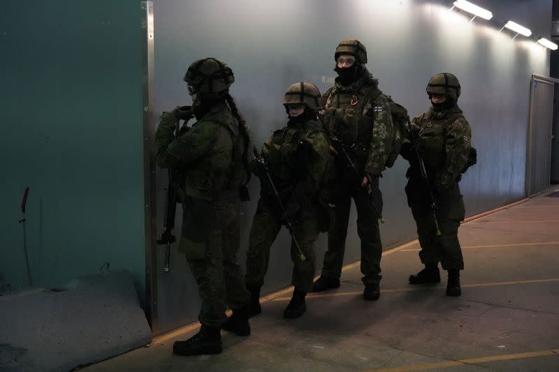 Finnish military police officers take part in a security drill in Vanhankaupunginkoski, in Helsinki