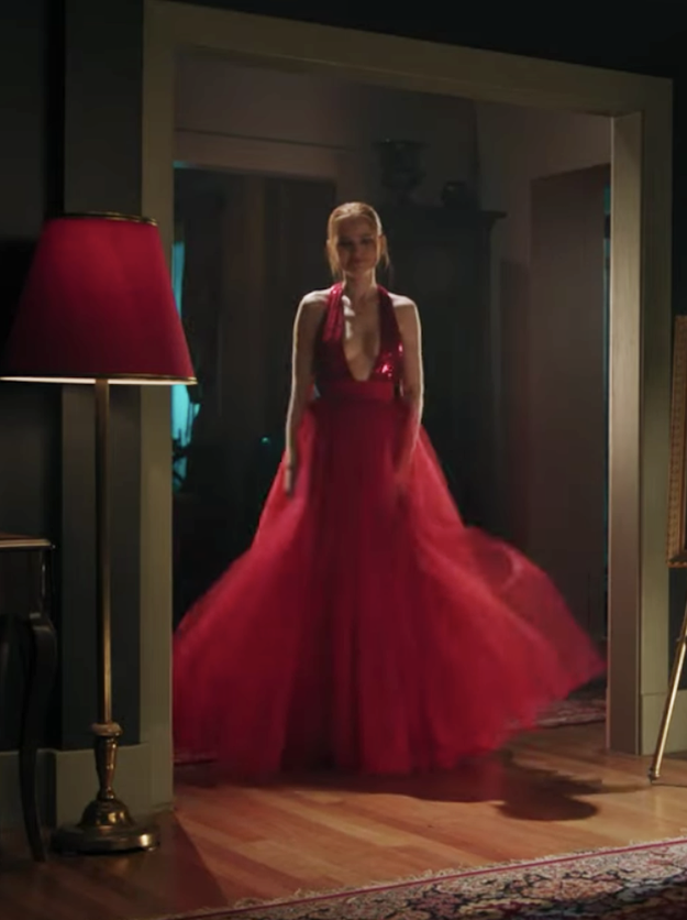 Cheryl Blossom wearing a dress with a deep V cut, a sequined bodice, and a tulle skirt