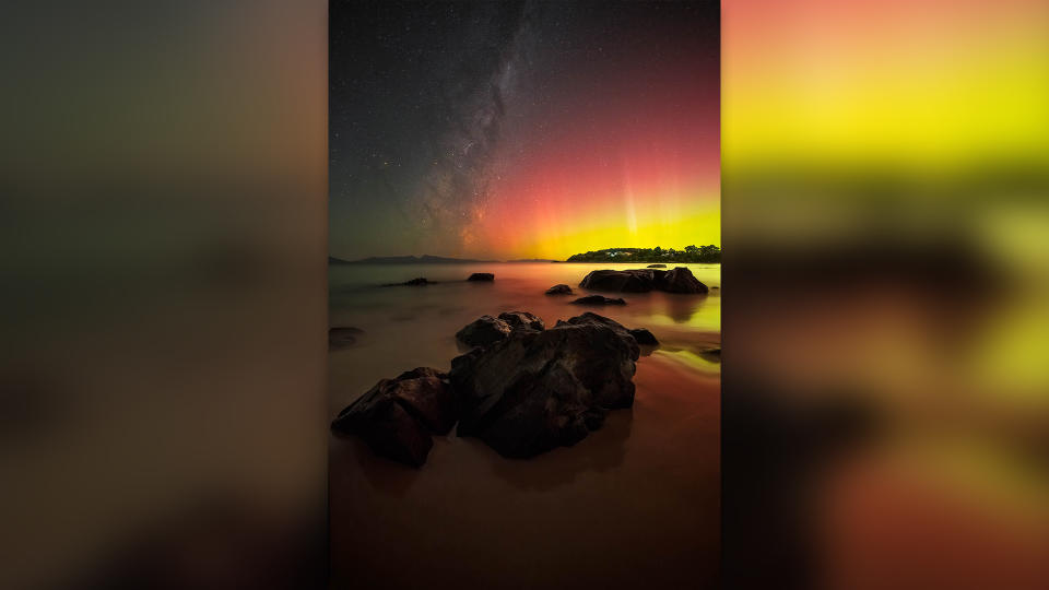 Purple and orange northern lights over Tasmania, Australia.