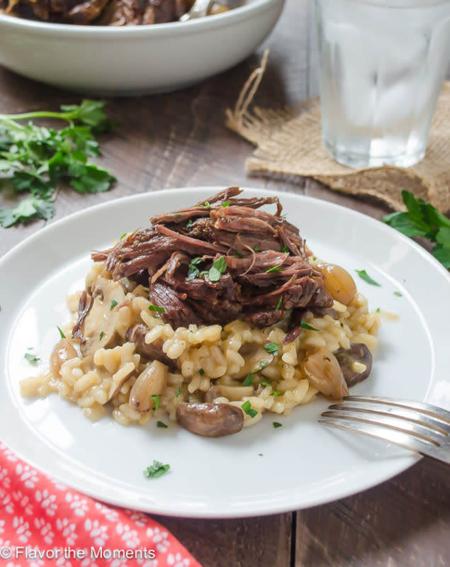 <p>Flavor The Moments</p><p>Tender beef short ribs braised in the slow cooker until the meat falls off the bone, and served over creamy mushroom risotto. This is a flavorful, comforting dish that the whole family will love!</p><p><strong>Get the recipe: <a href="https://flavorthemoments.com/beef-short-ribs-mushroom-risotto/" rel="nofollow noopener" target="_blank" data-ylk="slk:Beef Short Ribs with Mushroom Risotto;elm:context_link;itc:0;sec:content-canvas" class="link rapid-noclick-resp">Beef Short Ribs with Mushroom Risotto</a></strong></p>