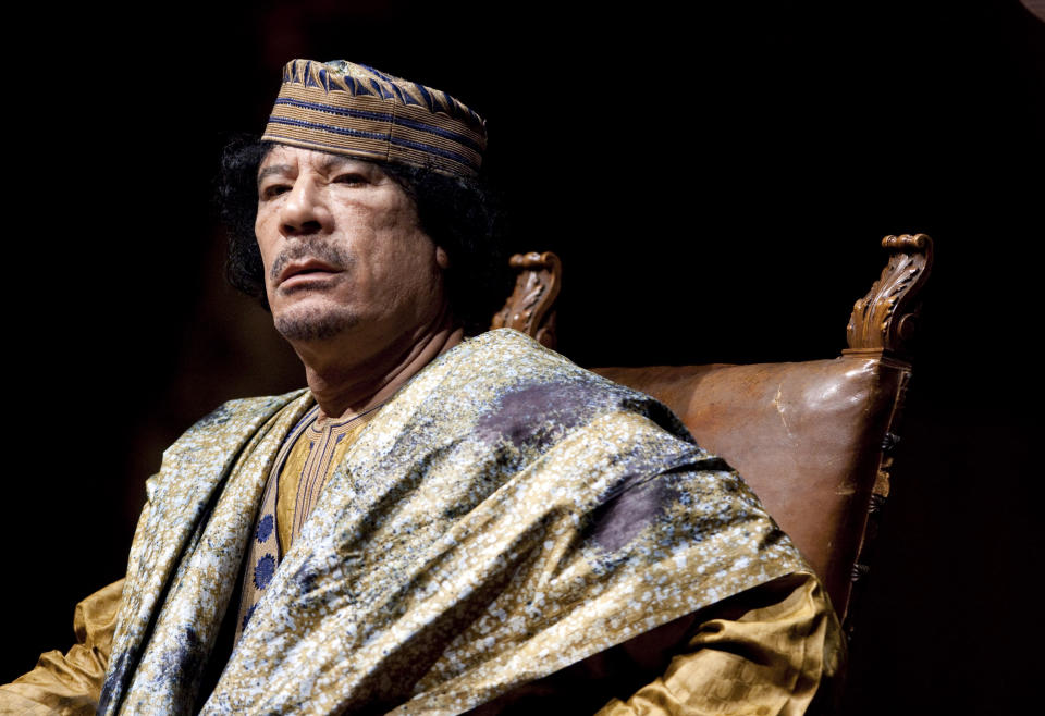 FILE - Libyan leader Muammar Gadhafi delivers his speech during a meeting with hundreds of prominent Italian women in a concert hall, June 12, 2009, in Rome. The former Libyan leader was captured and killed by rebels shortly after the International Criminal Court issued a warrant for his arrest on charges linked to the brutal suppression of anti-government protests in 2011. (AP Photo/Andrew Medichini, File)