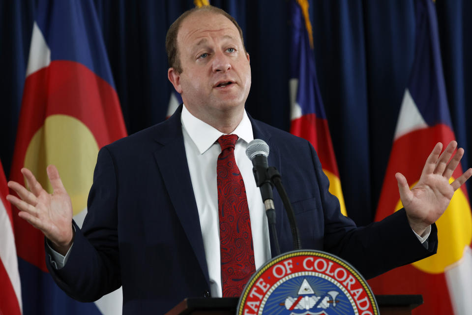 Colorado Governor Jared Polis makes a point during a news conference on the state's efforts against the new coronavirus Tuesday, July 21, 2020, in Denver.(AP Photo/David Zalubowski)