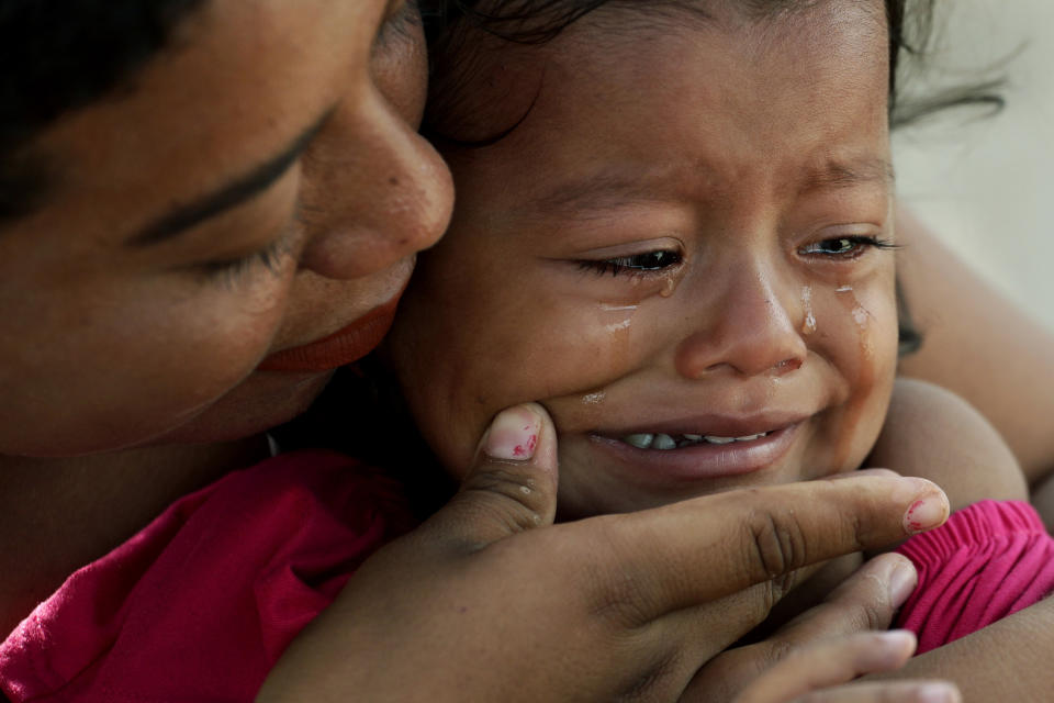 ** Attn Alyssa Goodman, Hold for story slugged Remain in Mexico Medical Conditions ** In this Tuesday, Nov. 5, 2019, photo, a migrant childâs tears are wiped away by her mother as they receive medical care at a sidewalk clinic in refugee camp across from Brownsville, Texas, in Matamoros, Mexico. The few doctors and nurses working in the camp are treating people including pregnant women and children with respiratory problems, skin conditions, diarrhea, and other diseases that can be linked to the campâs unsanitary conditions. (AP Photo/Eric Gay)