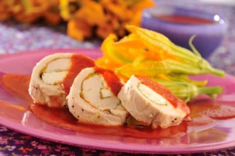 Chicken rolls with squash blossoms in guajillo pepper sauce (Luis G. Hernandez)