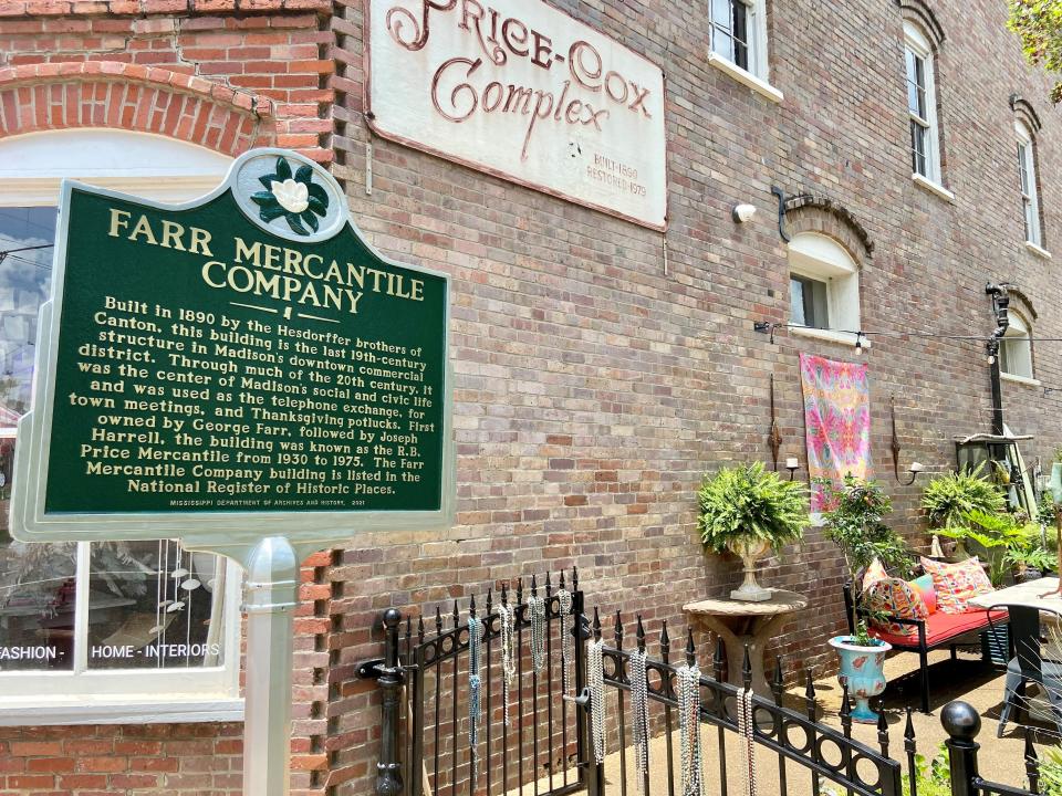 A marker at the site of the Farr Mercantile Company sits in the shopping district of Downtown Madison.