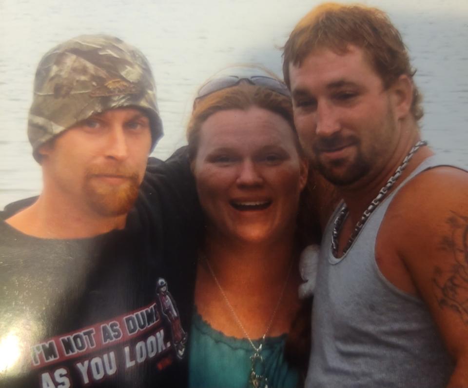 (From left to right) Siblings Laramie Brown, Virginia Collins and Buddy Brown pose during happier times.