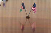 The flags of Afghanistan and the United States are seen on the table before a meeting between the Secretary of Defense Lloyd Austin and Afghan President Ashraf Ghani at the Pentagon in Washington, Friday, June 25, 2021. (AP Photo/Alex Brandon)