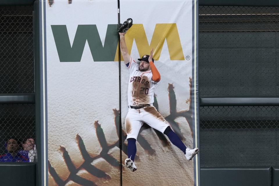 Houston Astros center fielder Chas McCormick catches a fly ball by Chicago Cubs' Dansby Swanson during the sixth inning of a baseball game Tuesday, May 16, 2023, in Houston. (AP Photo/David J. Phillip)