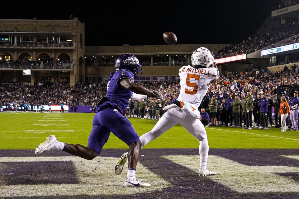 Texas wide receiver Adonai Mitchell hauls in a short touchdown pass Saturday night in the Longhorns' 29-26 win over TCU. It was Mitchell's ninth touchdown catch of the season, only four away from Jordan Shipley's school-record 13.
