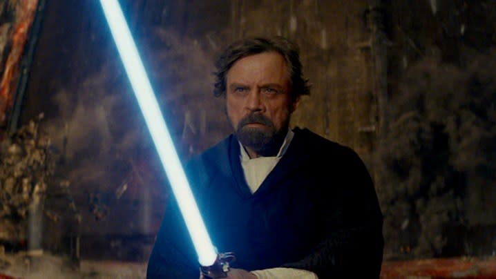 Luke Skywalker with a blue lightsaber at the climax of The Last Jedi.