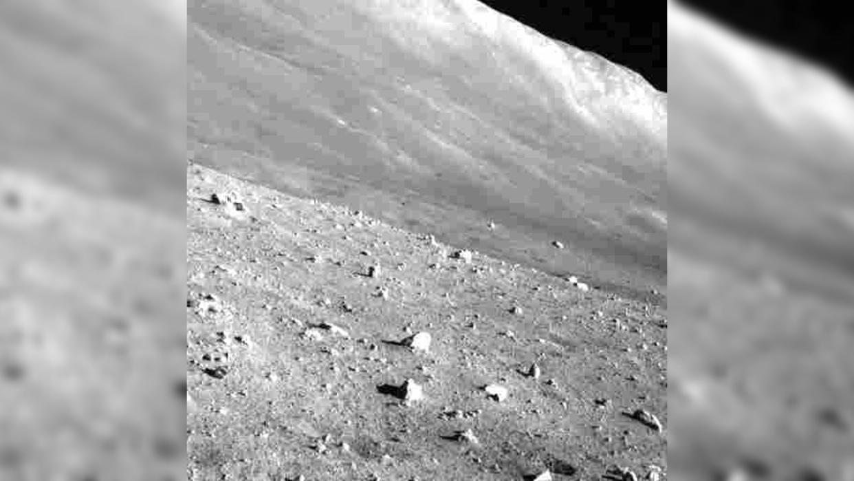  The grey, dusty surface of the moon as seen by a moon lander. 