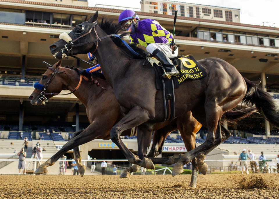 In this image provided by Benoit Photo, Maximum Security, outside, with Abel Cedillo aboard, overpowers Midcourt, inside, with Victor Espinoza aboard, to win the Grade II, $150,000 San Diego Handicap horse race Saturday, July 25, 2020, at Del Mar Thoroughbred Club in Del Mar, Calif. (Benoit Photo via AP)