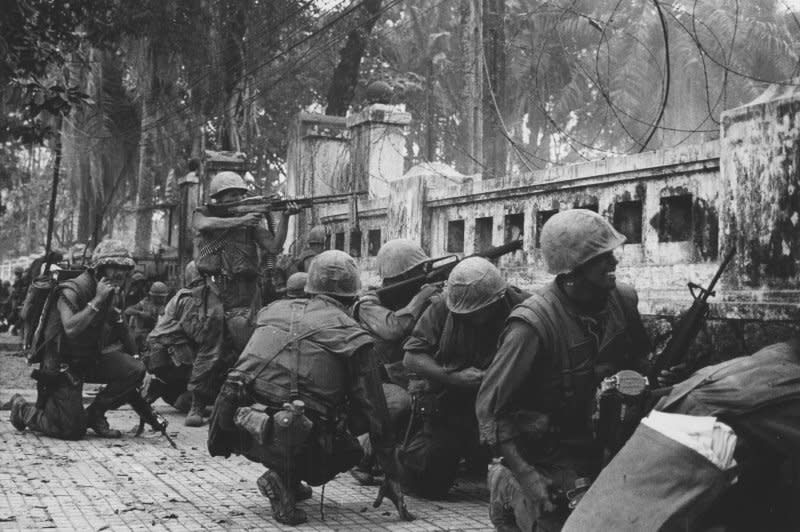 Marines are pinned down behind a wall near the old citadel in the city of Hue in South Vietnam on February 4, 1968. On February 1, I 1968, the communist Viet Cong began a major offensive in the Vietnam War with a fierce attack on the city. UPI File Photo