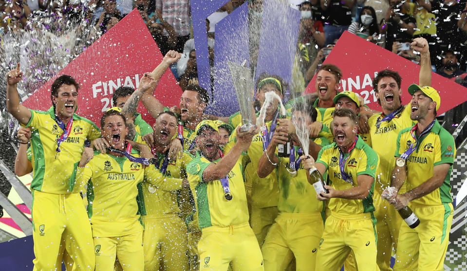 Australian cricketers celebrate after winning the Cricket Twenty20 World Cup final match in Dubai, UAE, Sunday, Nov. 14, 2021. (AP Photo/Aijaz Rahi)