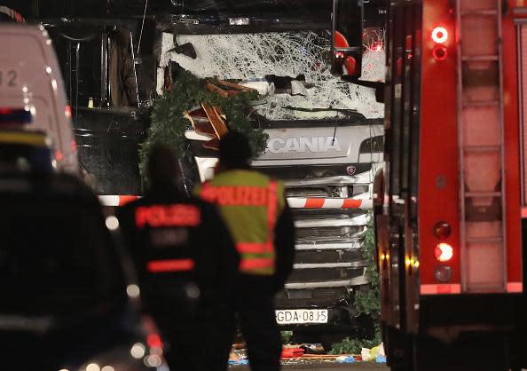 <p>Police stand near a black lorry that ploughed through a Christmas market in Berlin. Photo: Sean Gallup/Getty Images</p>