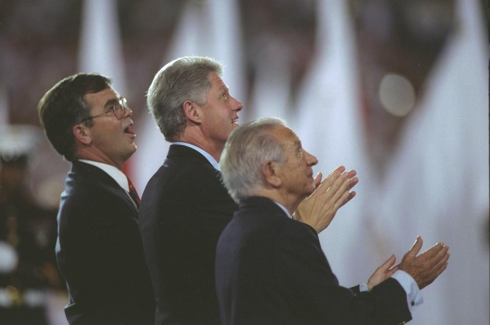 Billy Payne, president of ACOG, U.S. President Bill Clinton, and Juan Antonio Samaranch, president of the IOC, enjoy the Opening Ceremony of the 1996 Olympic Games in Atlanta, Georgia.