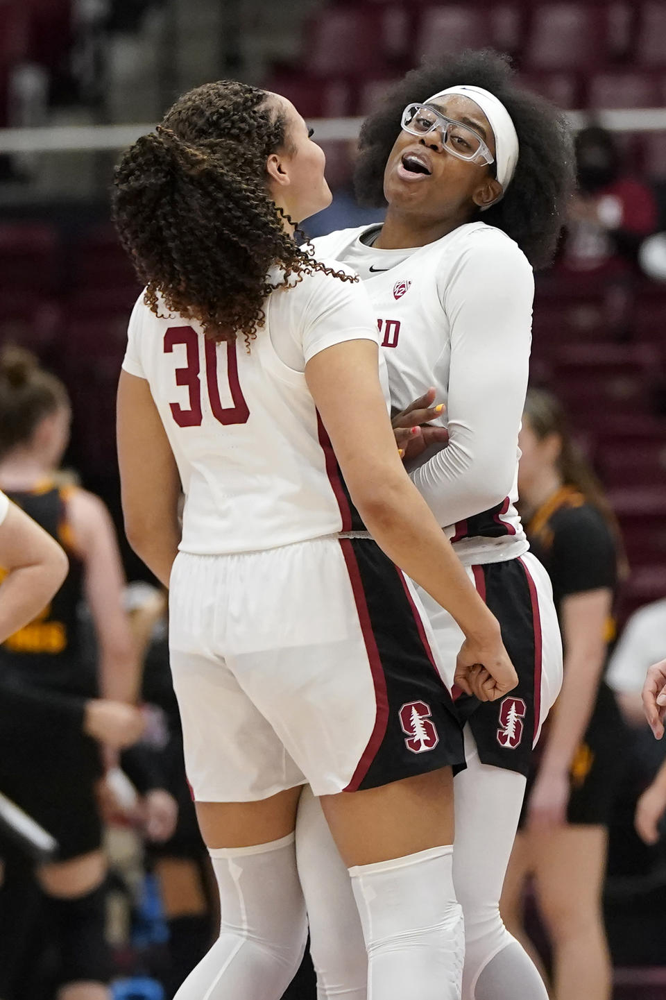 Stanford guard Haley Jones (30) celebrates with forward Francesca Belibi during the second half of an NCAA college basketball game against Arizona State in Stanford, Calif., Friday, Jan. 28, 2022. (AP Photo/Jeff Chiu)