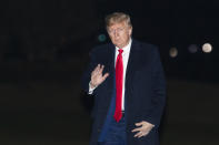 President Donald Trump waves upon arrival at the White House, Wednesday, Jan. 22, 2020, in Washington, from the World Economic Forum in Davos, Switzerland, (AP Photo/Manuel Balce Ceneta)