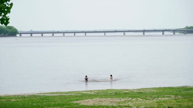 Children play in the water at Parc Moussette in Gatineau, Que., during the COVID-19 pandemic.