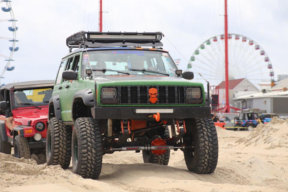 Jeep drivers ride along on the custom-made Sand Course during the Ocean City Jeep Fest.