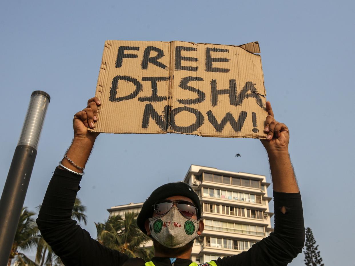 <p>A protester demands the release of climate activist Disha Ravi after her arrest by the Delhi police in connection with a toolkit shared by Greta Thunberg </p> (EPA)