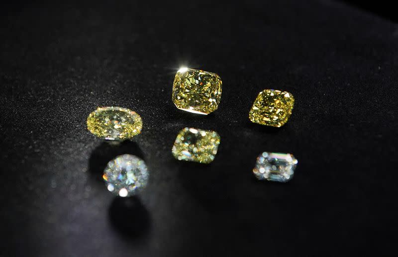 FILE PHOTO: A view shows polished colorless and yellow diamonds produced at "Diamonds of ALROSA" factory in Moscow
