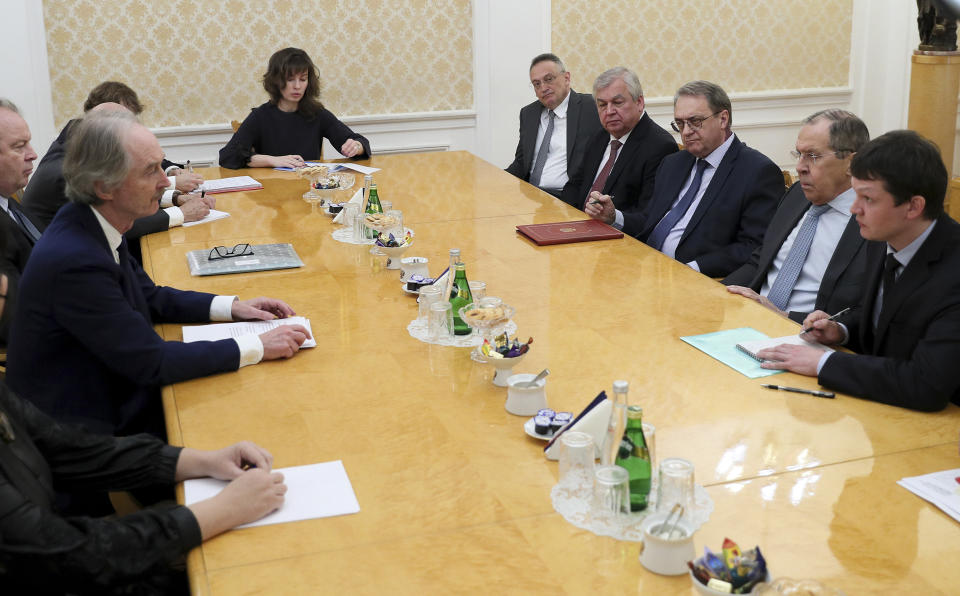 FILE - In this photo released by Russian Foreign Ministry Press Service, Russian Foreign Minister Sergey Lavrov, second right, and the U.N. special envoy for Syria Geir Pedersen, left, attend the talks in Moscow, on Feb. 23, 2022. (Russian Foreign Ministry Press Service via AP, File)