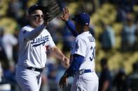 Mar 28, 2019; Los Angeles, CA, USA; Los Angeles Dodgers left fielder Joc Pederson (31) celebrates with manager Dave Roberts (right) after the game against the Arizona Diamondbacks at Dodger Stadium. Mandatory Credit: Kelvin Kuo-USA TODAY Sports